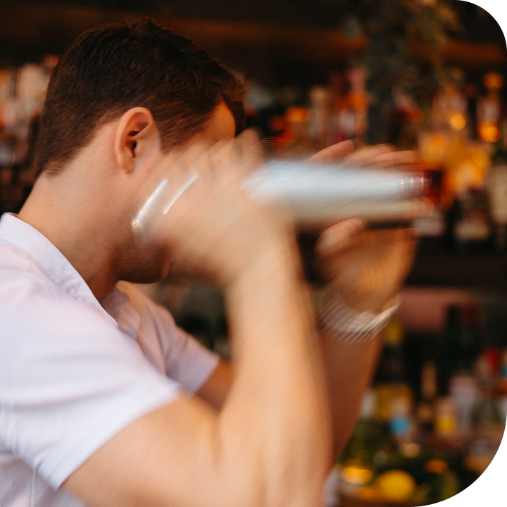 Guy shaking a bottle