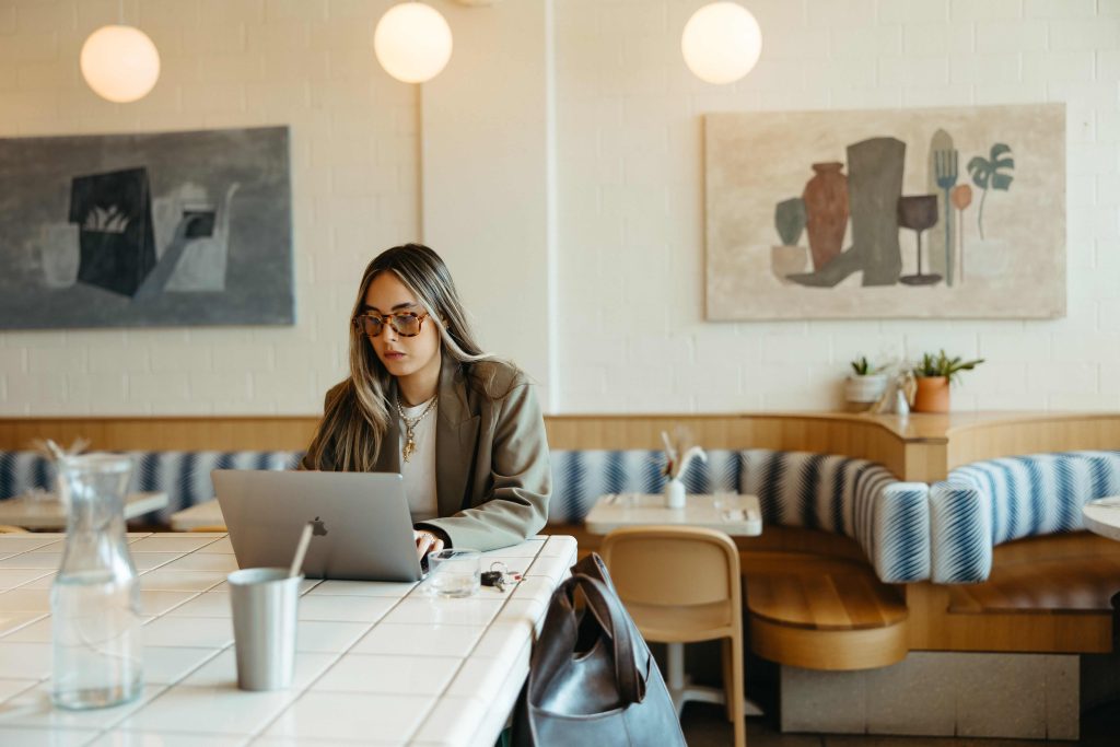 Girl sitting at a coffee shop doing her work