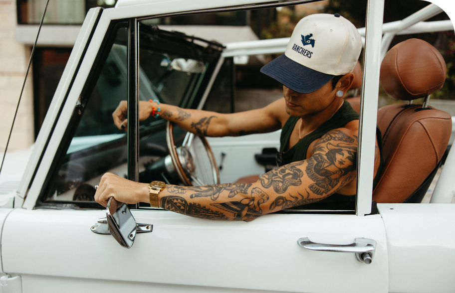 Tattooed driver cruising