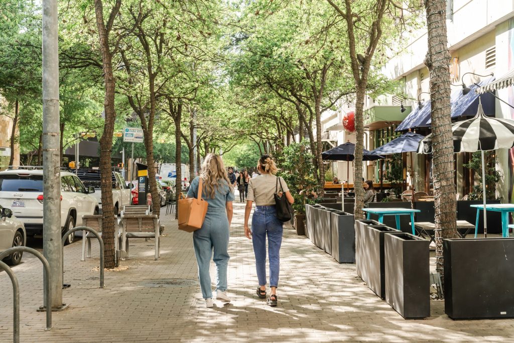 Two women walking along 2nd Street