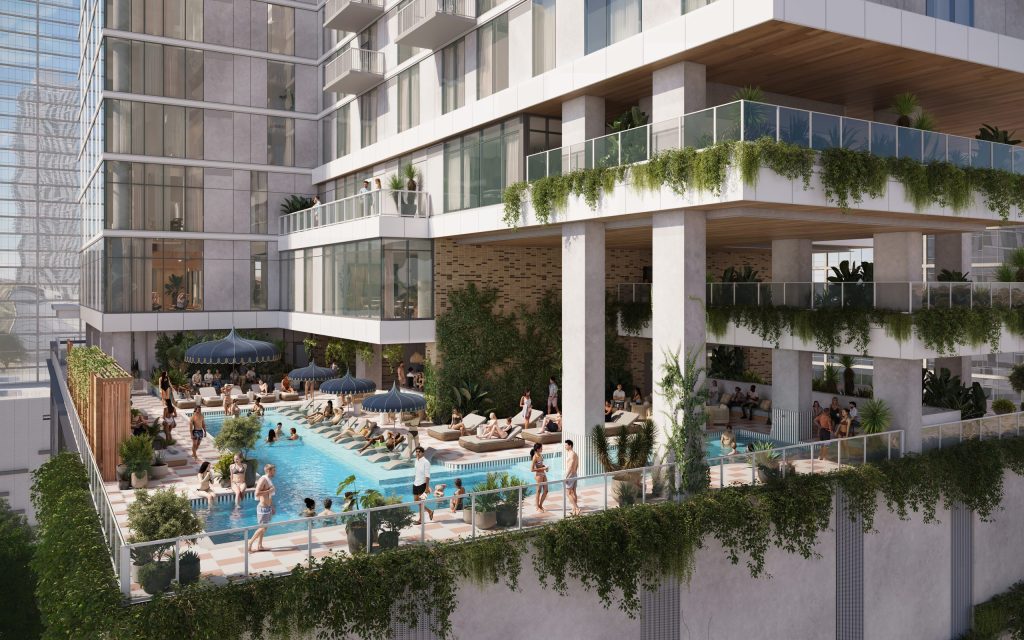 Luxury rooftop pool at Paseo ATX with lounge chairs, cabanas and residents enjoying the view in downtown Austin, Texas.