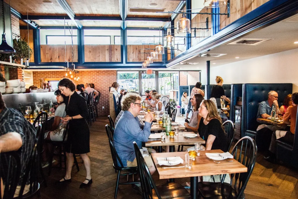 Busy dining room at Dai Due, a restaurant known as one of the best brunch spots in Downtown Austin, Texas.
