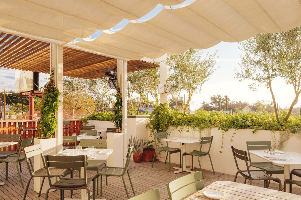 An exterior image of Paperboy café patio, named one of the best brunch spots in Downtown Austin, Texas.