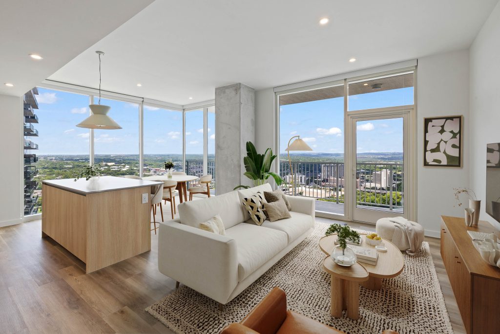 Living and kitchen space in unit at Paseo, a luxury apartment located in downtown Austin, Texas.