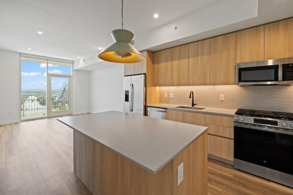 Living and kitchen space at Paseo, Rainey Street apartments in Austin, TX.