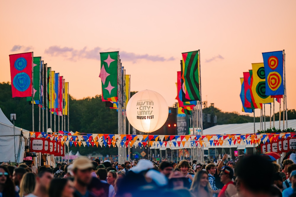 Sunset entrance with banners and lantern at Austin City Limits Festival offering ACL tips.