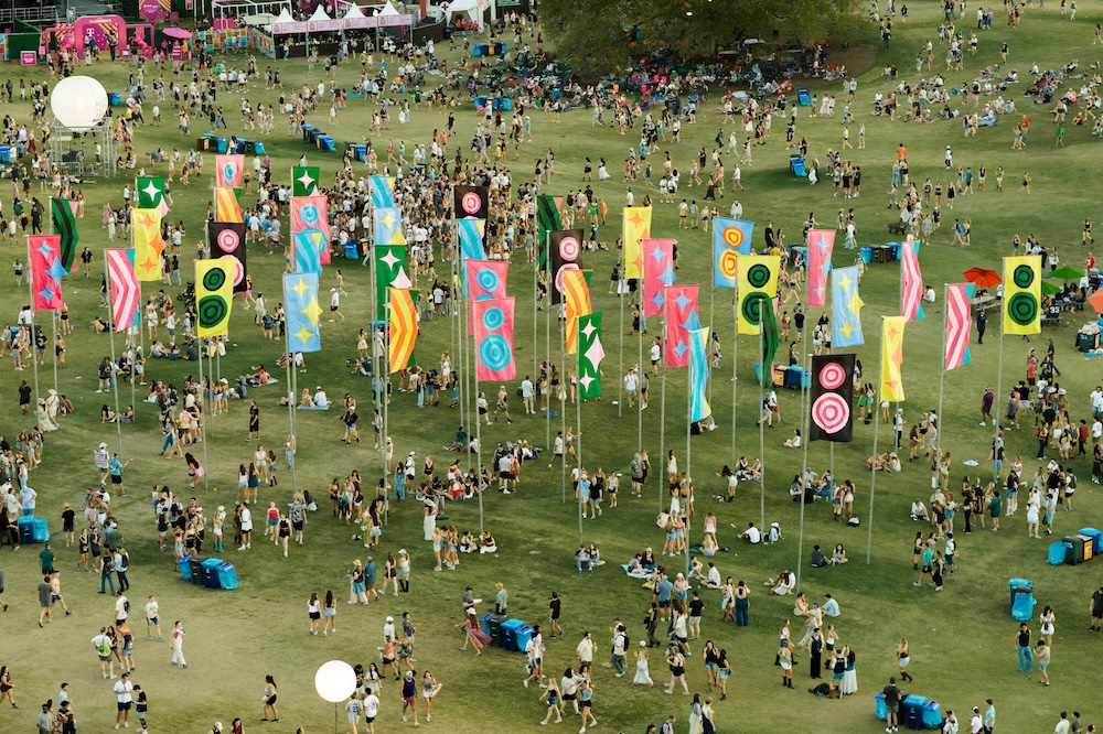 Colorful flags and festival crowds at Zilker Park for Austin City Limits with ACL tips.