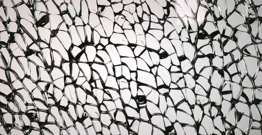 Tempered glass with a visible nickel sulfide inclusion, a small imperfection that can expand over time and cause safe shattering.