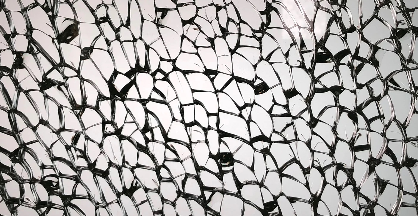 Tempered glass with a visible nickel sulfide inclusion, a small imperfection that can expand over time and cause safe shattering.